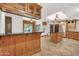 Open kitchen design featuring wooden cabinets, stainless steel appliances, and tile floors at 700 N Dobson Rd # 34, Chandler, AZ 85224