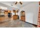 Spacious kitchen area with tile flooring, wooden cabinets, and a built-in bar area at 700 N Dobson Rd # 34, Chandler, AZ 85224