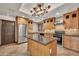 Open kitchen featuring granite countertops, wood cabinets, and stainless appliances at 700 N Dobson Rd # 34, Chandler, AZ 85224
