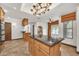 Bright kitchen with granite counters, chandelier, and large island at 700 N Dobson Rd # 34, Chandler, AZ 85224