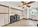 Bright laundry room with modern washer and dryer, ample cabinet space, and a wash sink at 700 N Dobson Rd # 34, Chandler, AZ 85224