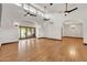 Bright living room with high ceilings, hardwood floors, and sliding glass doors at 700 N Dobson Rd # 34, Chandler, AZ 85224