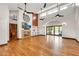 Spacious living room with hardwood floors, fireplace, high ceilings, and access to the outdoor pool area at 700 N Dobson Rd # 34, Chandler, AZ 85224