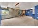 Spacious living room with a cozy fireplace, unique lighting fixtures, and elegant decorative mirrors at 700 N Dobson Rd # 34, Chandler, AZ 85224