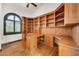 This home office features custom wood built-in shelves, cabinets, and desk space, offering both style and functionality at 700 N Dobson Rd # 34, Chandler, AZ 85224