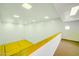 View of a racquetball court from an upper level with white cinder block wall, ready for a competitive match at 700 N Dobson Rd # 34, Chandler, AZ 85224