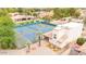 Aerial view of tennis courts, clubhouse, and surrounding lush landscaping at 700 N Dobson Rd # 34, Chandler, AZ 85224