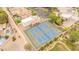 Aerial shot featuring tennis courts, clubhouse, and lush, green landscaping at 700 N Dobson Rd # 34, Chandler, AZ 85224
