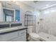 Bathroom featuring marble tile shower and vanity sink with a gray countertop at 7135 W Flower St, Phoenix, AZ 85033