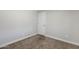 Neutral bedroom featuring tan carpet, white walls, and a standard closet door at 7135 W Flower St, Phoenix, AZ 85033