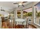 Bright breakfast nook with hardwood floors and backyard views from the large surrounding windows at 7304 E Bent Tree Dr, Scottsdale, AZ 85266