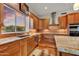 Beautiful kitchen with granite counters, stainless steel appliances, and wood cabinetry at 7304 E Bent Tree Dr, Scottsdale, AZ 85266