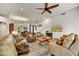 Inviting living room featuring hardwood floors, comfortable seating, and a ceiling fan at 7304 E Bent Tree Dr, Scottsdale, AZ 85266