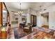 Elegant living room area with hardwood floors, stylish furnishings, and a bright window view at 7304 E Bent Tree Dr, Scottsdale, AZ 85266