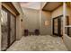 Open-air patio with seating area, tiled flooring, and attractive doors at 7304 E Bent Tree Dr, Scottsdale, AZ 85266