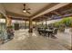 Large covered patio with travertine tile and multiple ceiling fans perfect for desert living at 7304 E Bent Tree Dr, Scottsdale, AZ 85266