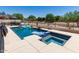 This in-ground pool and spa have many pool toys and a built-in barbeque area at 7385 W Honeysuckle Dr, Peoria, AZ 85383