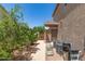 Side yard featuring mature trees, privacy fence, utility access and storage at 7385 W Honeysuckle Dr, Peoria, AZ 85383