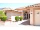 Home exterior with front door, walkway, and manicured landscaping at 9130 W Utopia Rd, Peoria, AZ 85382