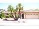 Charming single-story home with a tile roof, desert landscaping, and a two-car garage at 9130 W Utopia Rd, Peoria, AZ 85382