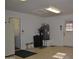 Practical garage with water heater, storage, and easy access to other areas at 9130 W Utopia Rd, Peoria, AZ 85382