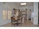 Open-concept kitchen featuring an island with breakfast bar and eat in dining space at 9130 W Utopia Rd, Peoria, AZ 85382