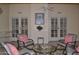 Relaxing sunroom with patio access, comfortable seating, and tranquil atmosphere at 9130 W Utopia Rd, Peoria, AZ 85382