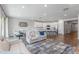 Bright and airy open concept features living, dining, and kitchen areas with modern furnishings and plenty of natural light at 9757 E Red Giant Dr, Mesa, AZ 85212