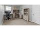 Dedicated home office area with modern desk setup, hutch, and built-in bookcase with storage at 9757 E Red Giant Dr, Mesa, AZ 85212