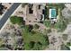 Aerial view of a luxury home showcasing the pool, landscaping, and tile roof at 9939 E Desert Jewel Dr, Scottsdale, AZ 85255