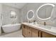 Modern bathroom with sleek vanity, oval soaking tub, and stylish, modern finishes at 9939 E Desert Jewel Dr, Scottsdale, AZ 85255