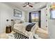 Cozy bedroom featuring a stylish bed, zebra rug, and window overlooking beautiful landscape at 9939 E Desert Jewel Dr, Scottsdale, AZ 85255
