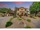 Stunning exterior showcasing the house's unique architecture, landscaping, and inviting curb appeal at 9939 E Desert Jewel Dr, Scottsdale, AZ 85255