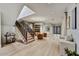 Spacious foyer with modern staircase, stylish decor, and plenty of natural light creating an inviting entrance at 9939 E Desert Jewel Dr, Scottsdale, AZ 85255