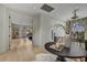 Bright hallway with hardwood floors leading to a cozy seating area; staircase visible at 9939 E Desert Jewel Dr, Scottsdale, AZ 85255