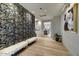 Stylish hallway featuring a unique accent wall and sleek lighting, adding a touch of elegance to the space at 9939 E Desert Jewel Dr, Scottsdale, AZ 85255