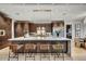Spacious kitchen with a large island, stylish seating, modern appliances, and ample storage space at 9939 E Desert Jewel Dr, Scottsdale, AZ 85255
