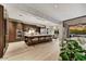 Open concept kitchen with a large island, stainless steel appliances, and seamless flow to the living area at 9939 E Desert Jewel Dr, Scottsdale, AZ 85255