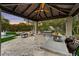 Well-equipped outdoor kitchen with a grill and bar, ideal for al fresco dining and entertaining with scenic views at 9939 E Desert Jewel Dr, Scottsdale, AZ 85255