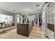 Organized walk-in closet featuring custom shelving, ample storage space, and a stylish island for convenience at 9939 E Desert Jewel Dr, Scottsdale, AZ 85255