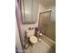 Cozy bathroom featuring a toilet, shower and built-in cabinet at 1004 S Kiowa Cir, Apache Junction, AZ 85119