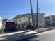 Exterior of the mobile home featuring a covered patio and a driveway at 1004 S Kiowa Cir, Apache Junction, AZ 85119