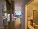 Hallway view showing the kitchen, dining table, and bathroom at 1004 S Kiowa Cir, Apache Junction, AZ 85119