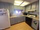 A kitchen view featuring gray cabinetry and appliances at 1004 S Kiowa Cir, Apache Junction, AZ 85119