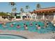 Outdoor swimming pool where people are doing water aerobics, creating a vibrant community atmosphere at 1004 S Kiowa Cir, Apache Junction, AZ 85119