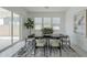Modern dining room with large windows and sliding door at 11045 N Hershey St, Surprise, AZ 85388