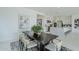 Dining room with table and chairs overlooking modern kitchen at 11045 N Hershey St, Surprise, AZ 85388