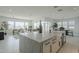 Modern kitchen with large island, stainless steel appliances, and bright, open floor plan at 11045 N Hershey St, Surprise, AZ 85388