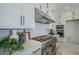 Gourmet kitchen featuring stainless steel gas range, custom cabinets, and modern backsplash at 11045 N Hershey St, Surprise, AZ 85388