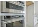 Modern stainless steel built-in KitchenAid oven and microwave combination at 11045 N Hershey St, Surprise, AZ 85388